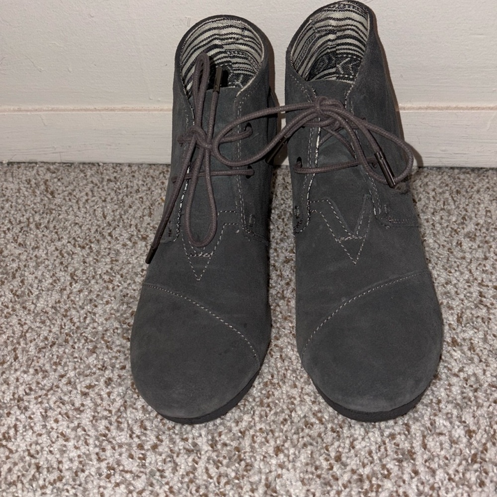 Tom’s worn once laced suede gray boots. Nice wedge ankle boots.